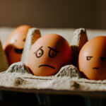 eggs with expressions drawn on faces