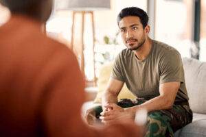two seated people talking face-to-face