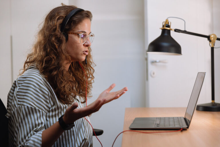 woman talking via laptop
