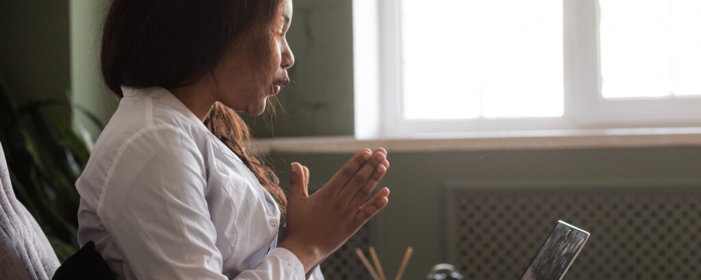 Woman receiving online therapy.