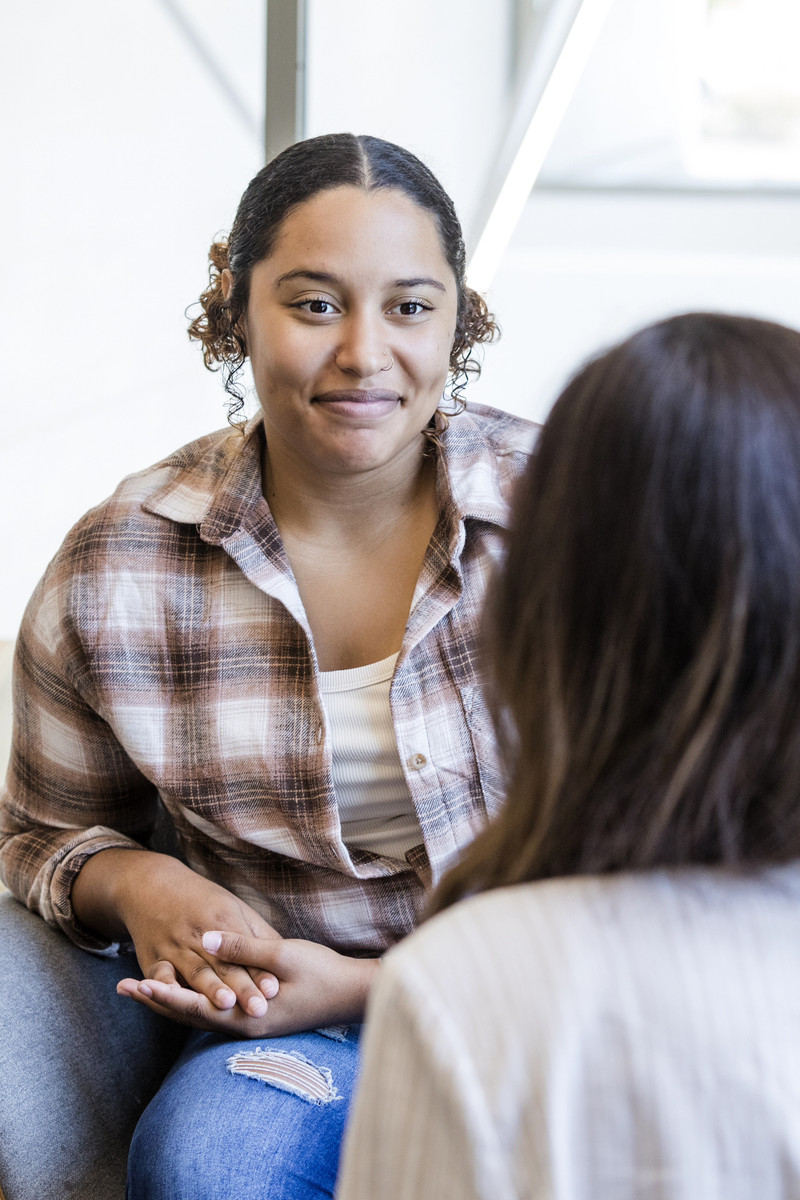 two women smiling and talking