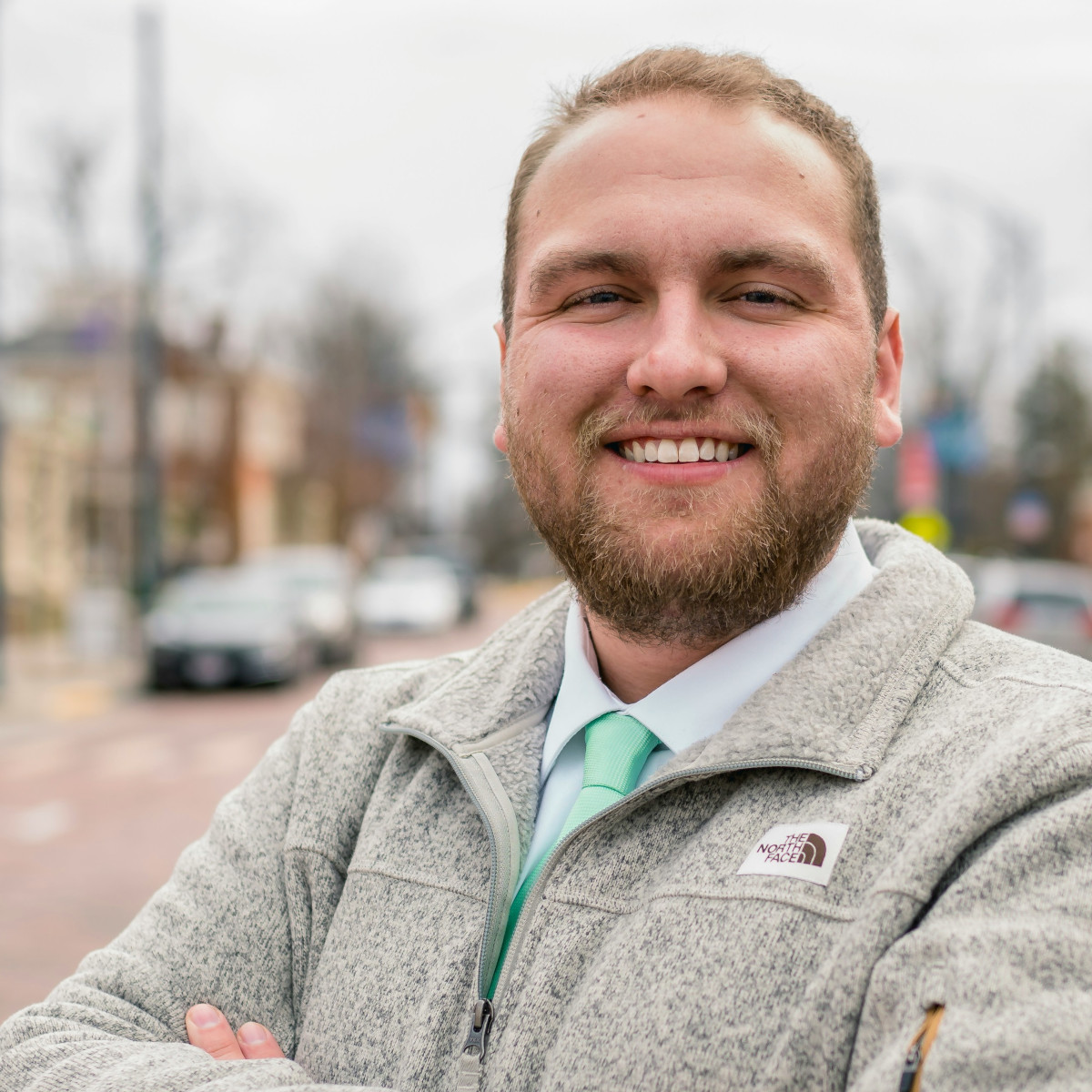 man smiling in street